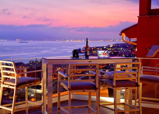 Bar table with sea view and sunset