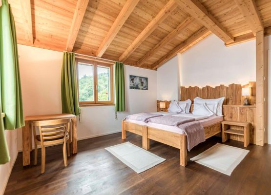 The olive bedroom made of local olive wood, with shutters, fly screens, underfloor heating