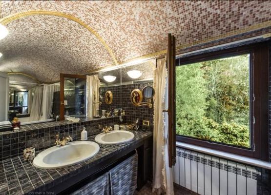 golden mosaic double jacuzzi bathroom